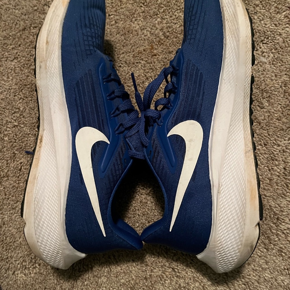 Nike Blue Athletic Shoes with White Swoosh and Cushioned Sole